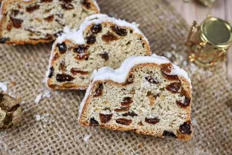 Slices of traditional German christmas season sweet food called 'Stollen' or 'Christstollen'