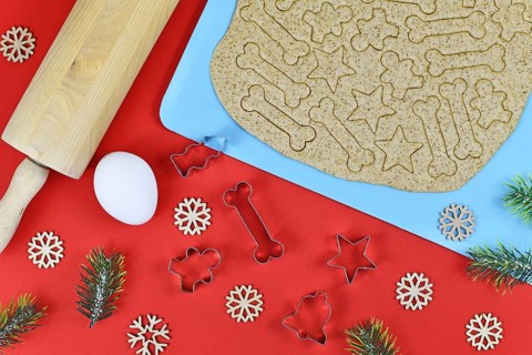 Baking Christmas cookies for dogs. Cookie cutters in shape of bones