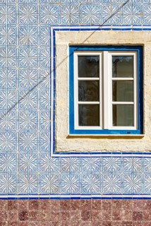 Traditional azulejo wall tiles and window