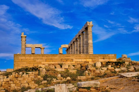 Beautiful sunset sky and ancient ruins of temple of Poseidon