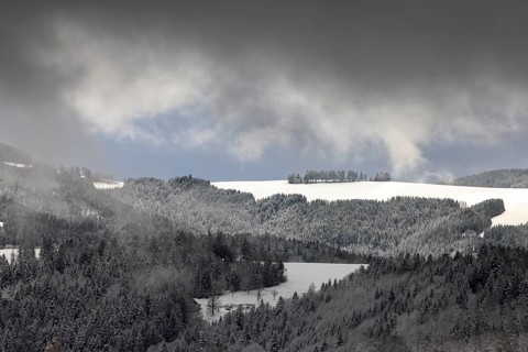 Fresh snow in November with a wonderful view of the Black Forest in a cloudy atmosphere
