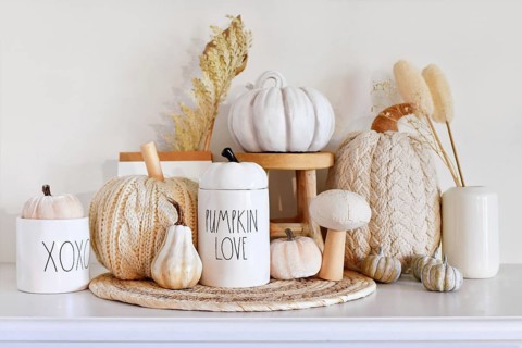Boho style fall decor with pumpkins and dried flowers and copy space