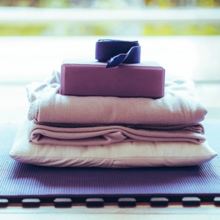 Yoga equipment placed on floor. Yoga mat