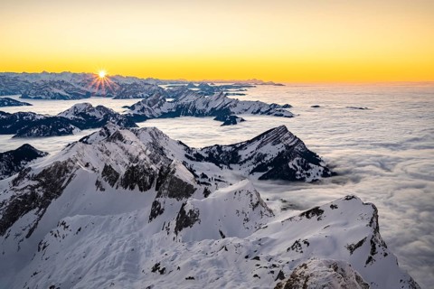 View from the Saentis to the mountains of Central Switzerland at sunset