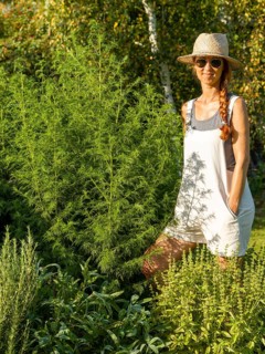 Woman in herb bed