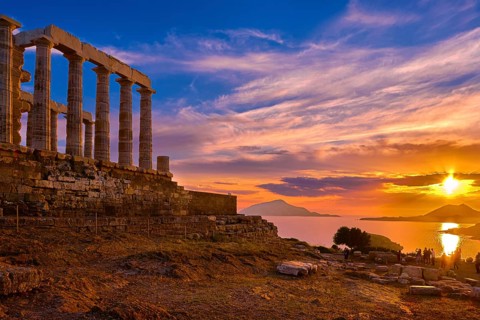 Beautiful sunset sky and ancient ruins of temple of Poseidon