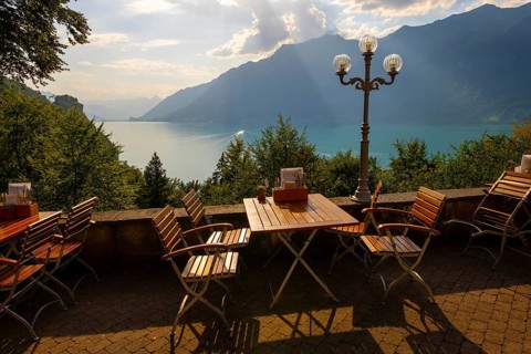 Restaurant Terrace View from The Historical Grandhotel Giessbach with View over Mountain and Lake Brienz with Sunlight in Giessbach