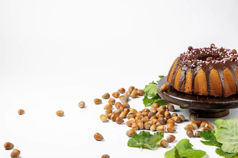 Vegan hazelnut cake on wooden serving plate
