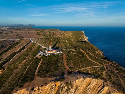 Aerial drone view of lighthouse on Cabo Espichel cape Espichel on Atlantic ocean
