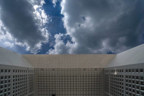 Cloudy sky and underside of the roof of the Grand Arche