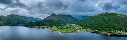 Aerial panorama of the freshwater loch Loch Leven with the village of Glen Coe