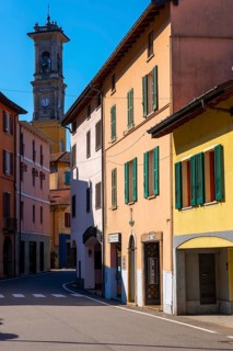 City of Porto Ceresio and Church Tower in a Sunny Summer Day in Porto Ceresio