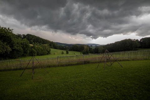 Rainy weather with meadow and farm