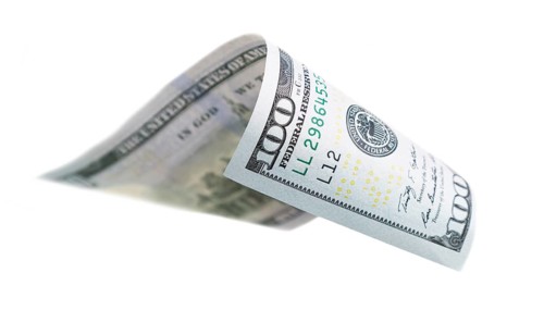 One hundred dollar bill falling or floating on empty background