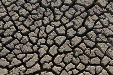 Abstract pattern of dry cracked clay mud in dried up lake bed
