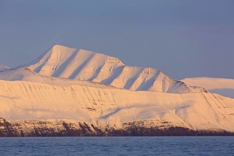 Snow covered mountains at Billefjorden at sunset