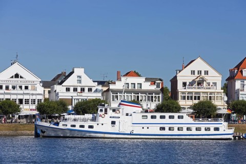 The ship MS Sven Johannsen on the river Trave in front of Vorderreihe at Travemuende