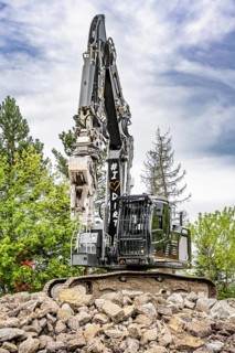 Black Liebherr crawler excavator recycling on demolition site