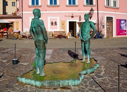 Two male figures peeing