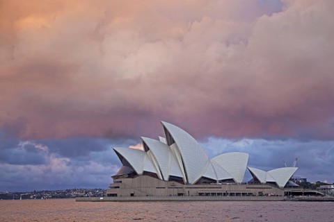 Heavy rain clouds and approaching thunderstorm over the Sydney Opera House at sunset