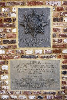 Memorial plaque to the Coldstream Guards at the south gate of the Chateau d'Hougoumont