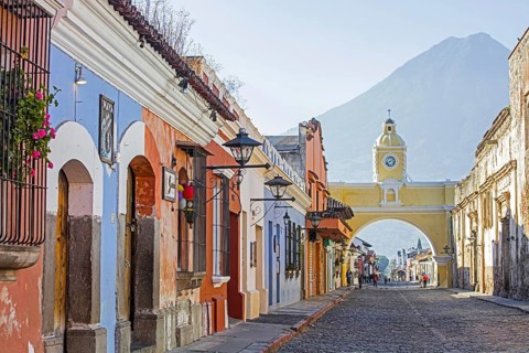 Colourful colonial houses and the 17th century Arco de Santa Catalina Arch in the city Antigua Guatemala
