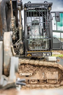 Black Liebherr crawler excavator recycling on demolition site
