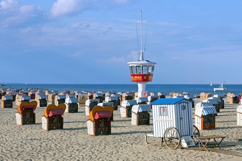 Roofed wicker beach chairs on the beach at Travemuende