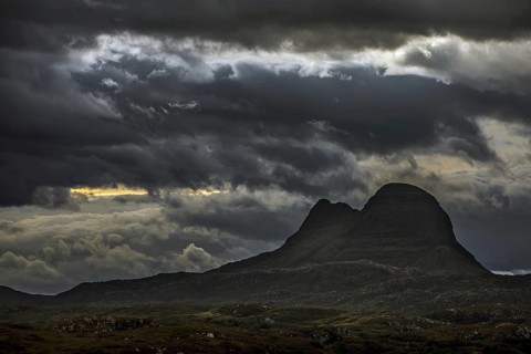 Storm clouds over the mountain Suilven at night