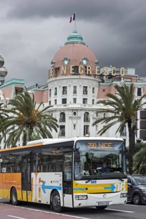 City bus and the Hotel Le Negresco on the Promenade des Anglais in Nice