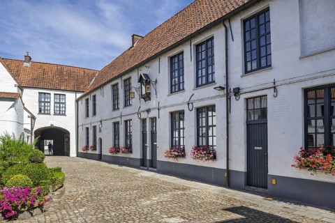 17th century white beguines' houses in courtyard of the Beguinage of Oudenaarde