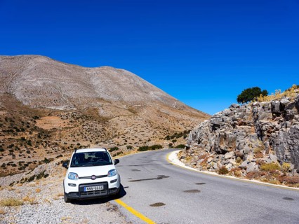 Car parked on mountain road at Psiloritis