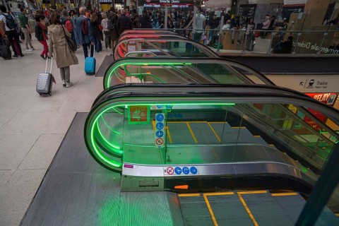 Colourfully illuminated escalators in the Gare de Lyon