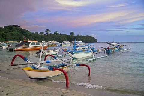 Traditional outrigger fishing boats on the beach at Padang Bai