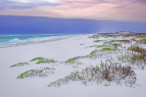 White quartz sand dunes at sunset along the Gulf of Mexico at Gulf Islands National Seashore in winter