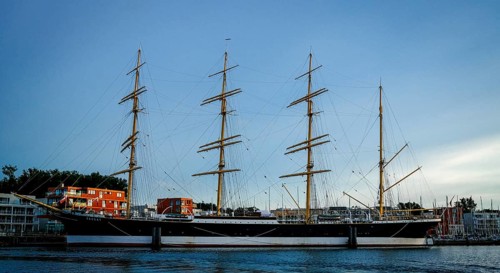 Museum sailing ship Passat in Priewall harbour at sunset