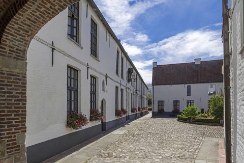 White beguines' houses in courtyard of the Beguinage of Oudenaarde