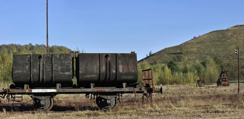 Wagon and abandoned spoil tip of the coal mine at Beringen