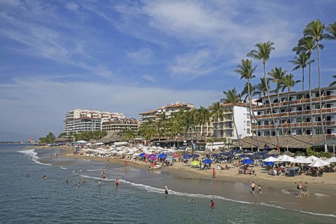 Sunbathers and hotels at Puerto Vallarta