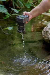 A reflex camera accidentally falls into the river