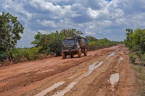 4x4 truck riding along the muddy Linden-Lethem dirt road linking Lethem and Georgetown in the rainy season