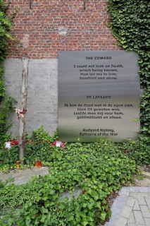 World War One execution pole and epitaph The Coward by Rudyard Kipling at inner courtyard of the Poperinge town hall