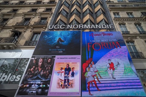 Large posters of a cinema advertisement on the Champs Elysees