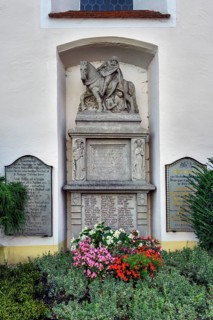 War memorial with floral decorations