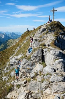 Hiker at the summit of the Grosse Klammspitze