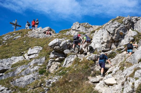 Hiker at the summit of the Grosse Klammspitze