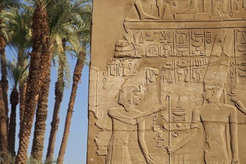 Frieze with Egyptian hieroglyphs on wall at the Karnak Temple Complex