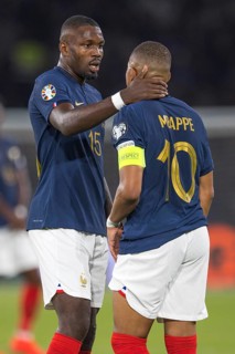 Marcus THURAM France caring for Kylian MBAPPE France re