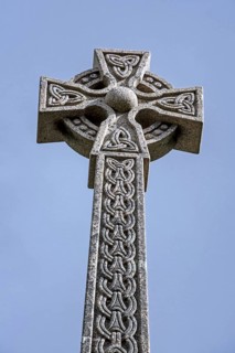 Monument with Celtic cross commemorating the Massacre of the Clan MacDonald of Glencoe in 1692