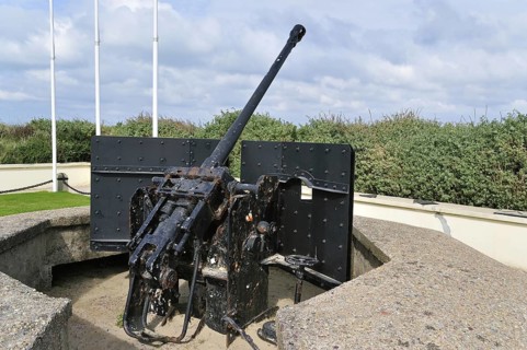 Second World War Two German anti-aircraft gun near the WW2 Utah Beach Landing Museum at Sainte-Marie-du-Mont
